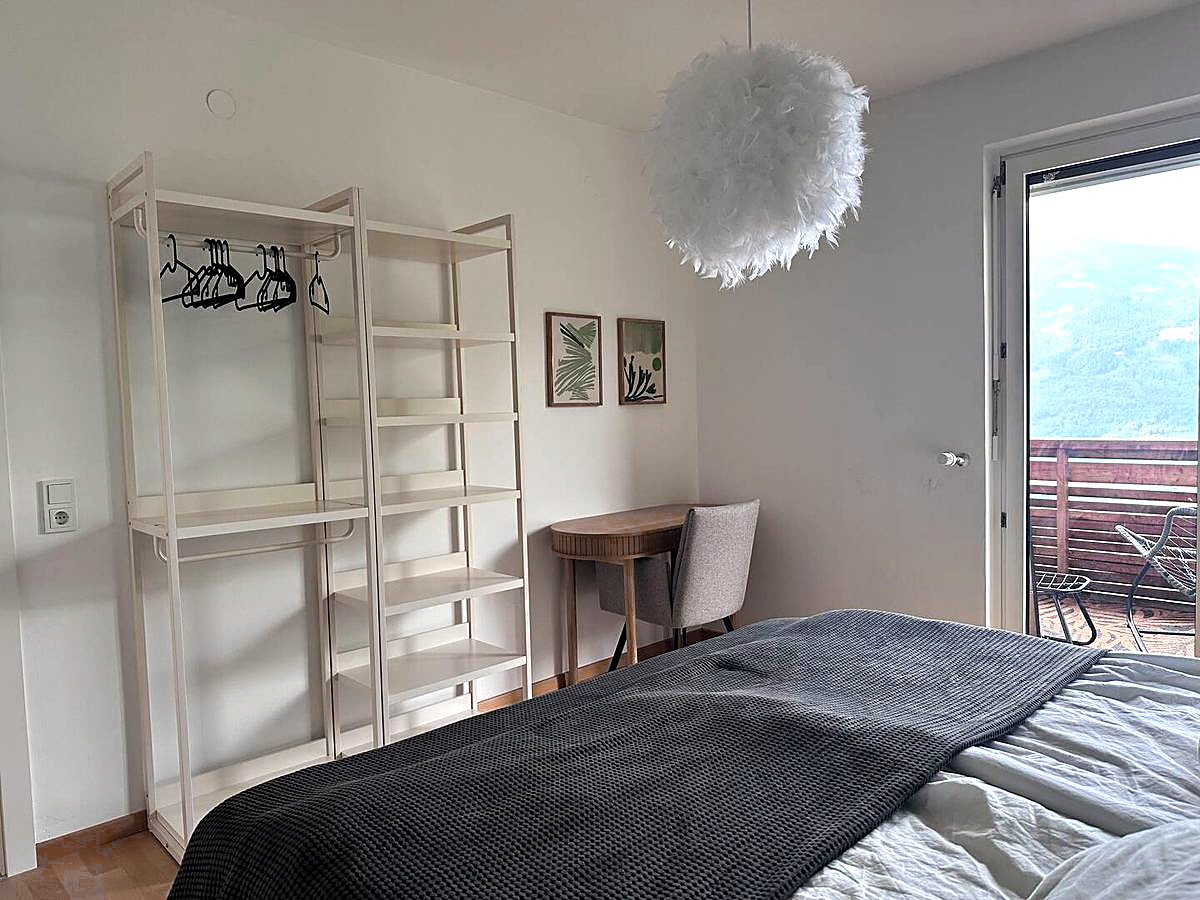 Bedroom with terrace door and mountain view, holiday apartment East Tyrol